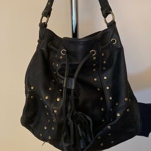 Paradox leather purse with brass grommets